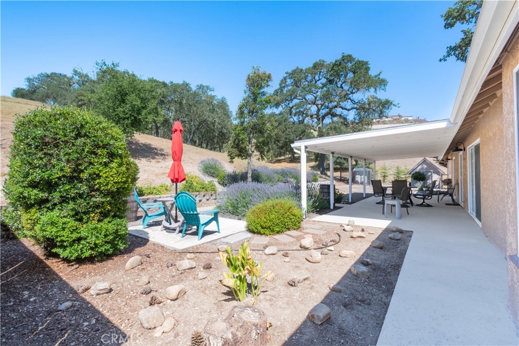 2085 Hanging Tree Lane Templeton, CA 93465 - Photo 24 of 33 Landscaped backyard area. Enjoy sitting on the small patio area surrounded by beautiful lavender and the sun.