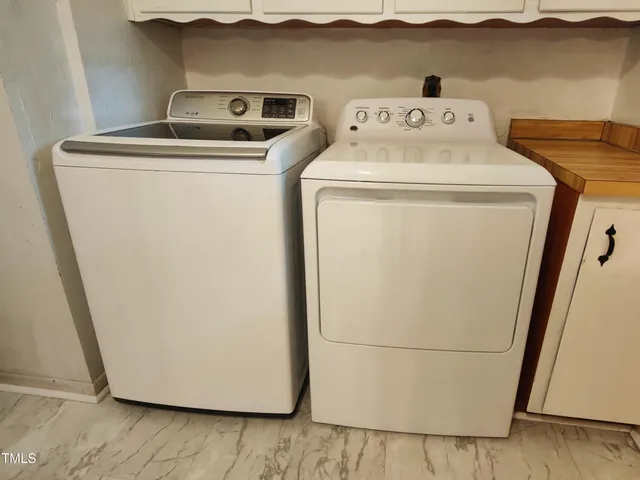 a refrigerator freezer sitting in a kitchen with a refrigerator