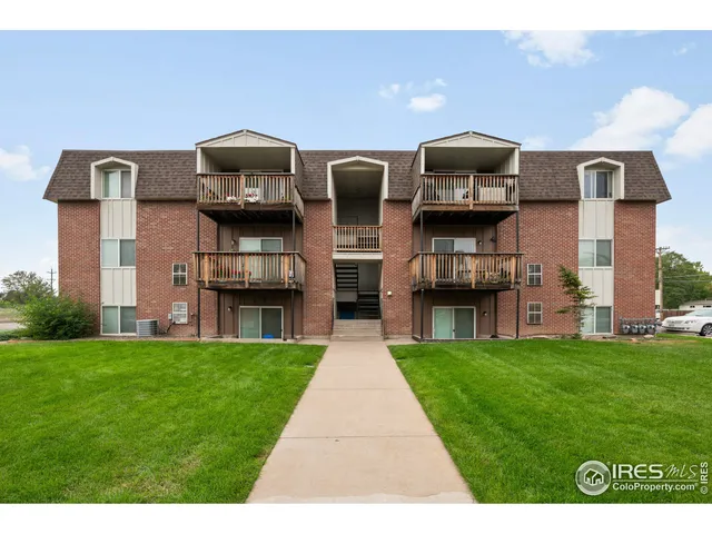 a front view of building with yard