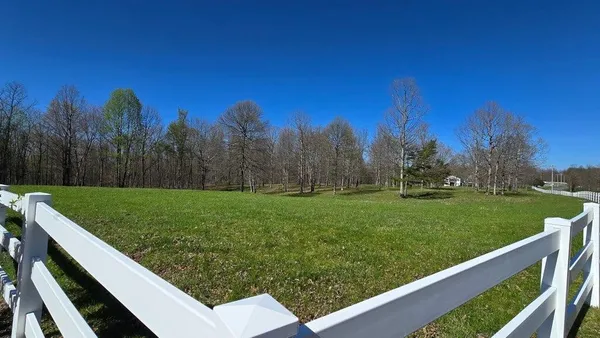 a view of a garden from a balcony