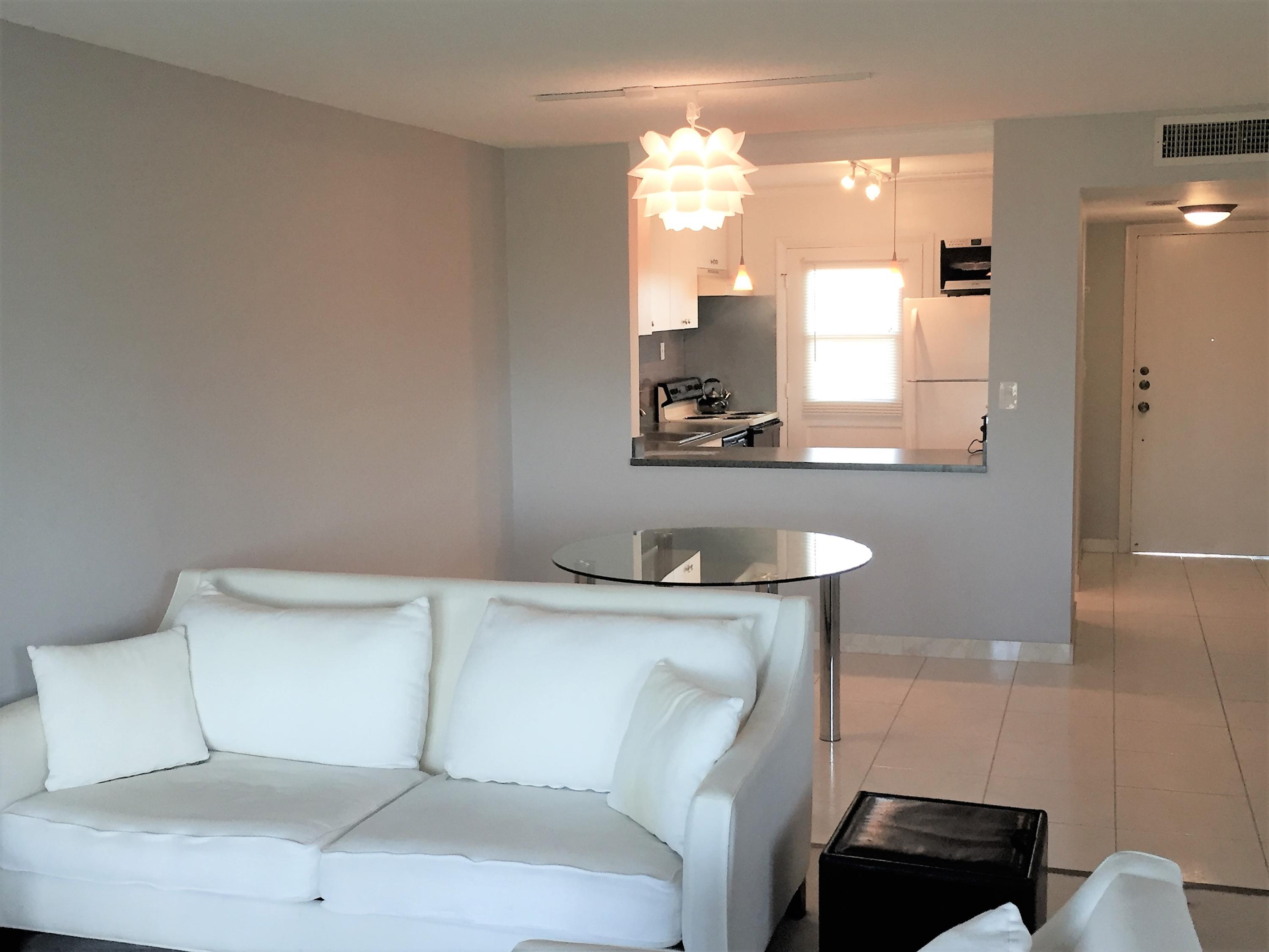 6161 Northwest 2nd Avenue, Unit 421 Boca Raton, FL 33487 - Photo 6 of 34 Living Room towards Kitchen Pass-Though