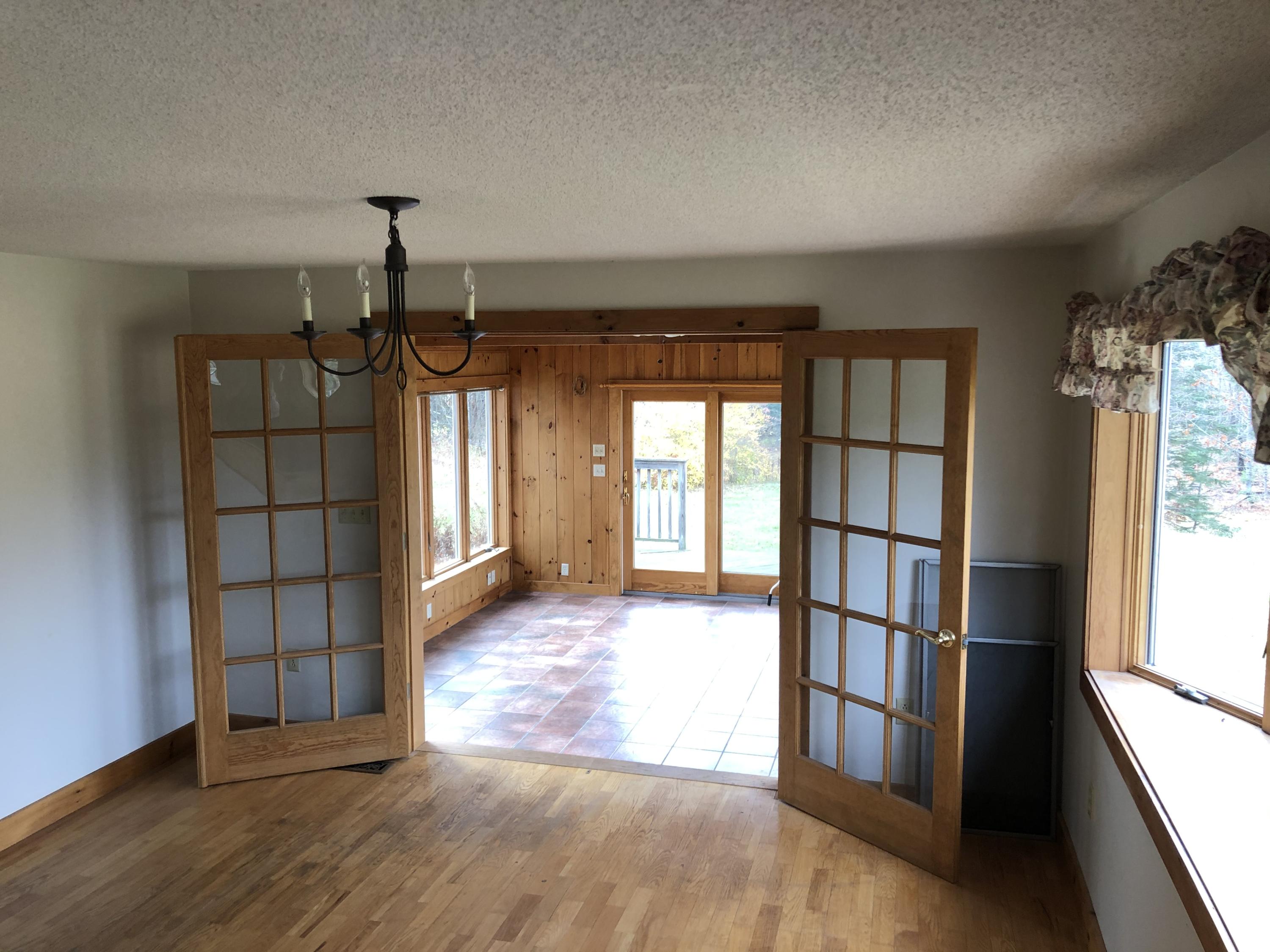 55 Sawyer Notch Road Andover, ME 04216 - Photo 9 of 36 dining room french doors to sunroom