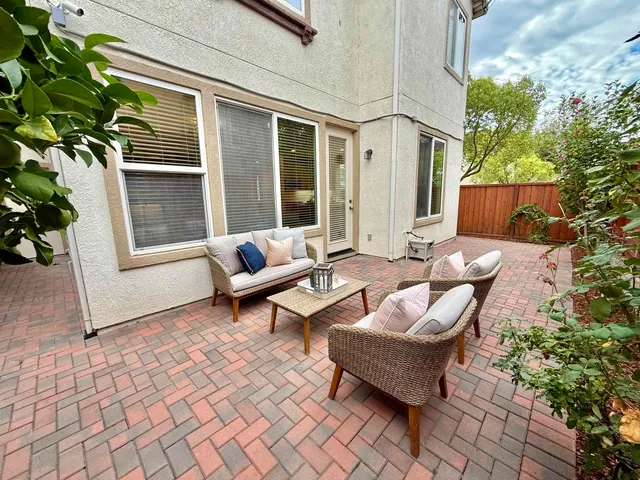 a outdoor space with patio furniture and a potted plant