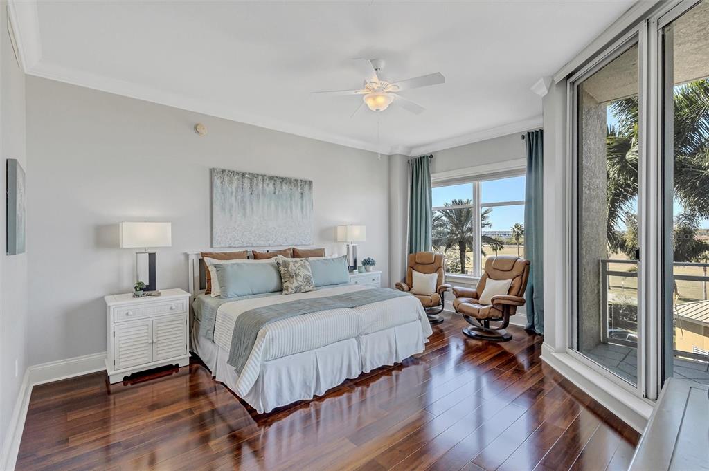 140 Riviera Dunes Way, Unit 206 Palmetto, FL 34221 - Photo 13 of 46 a bedroom with a bed and a large window