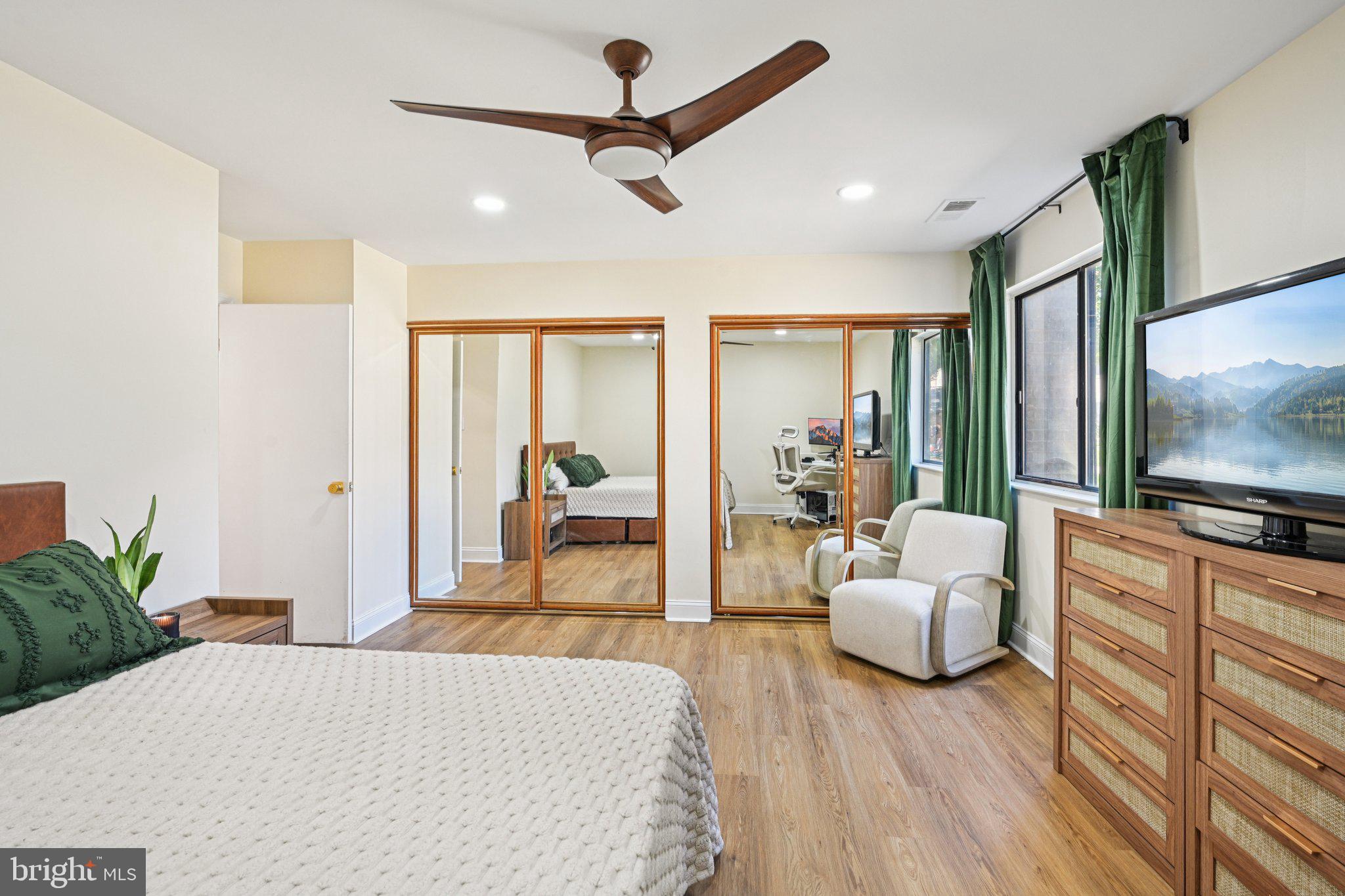 115 East Kings Highway, Unit 319 Maple Shade, NJ 08052 - Photo 19 of 37 a living room with furniture and a flat screen tv