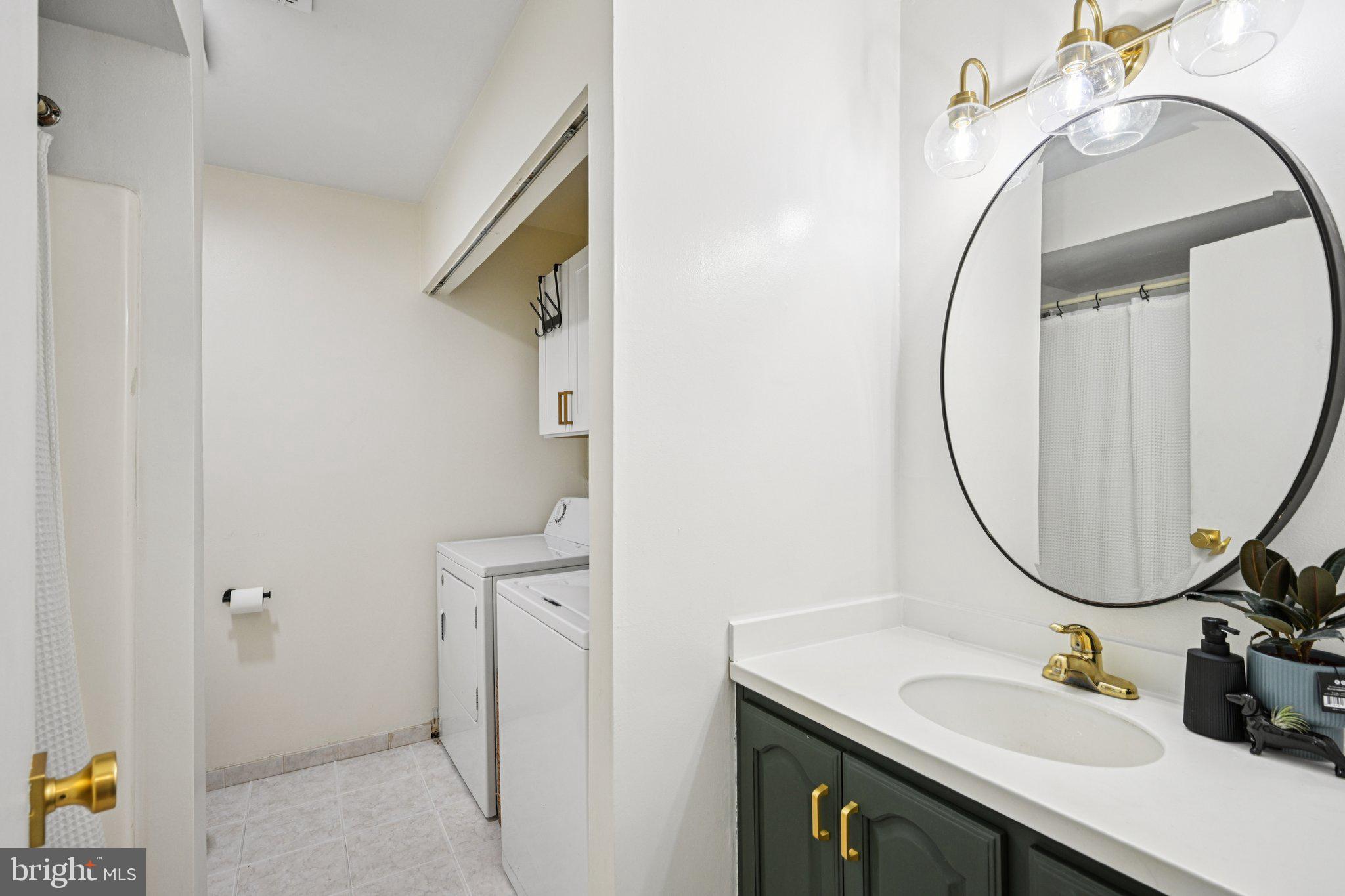 115 East Kings Highway, Unit 319 Maple Shade, NJ 08052 - Photo 20 of 37 a bathroom with a sink vanity and a mirror