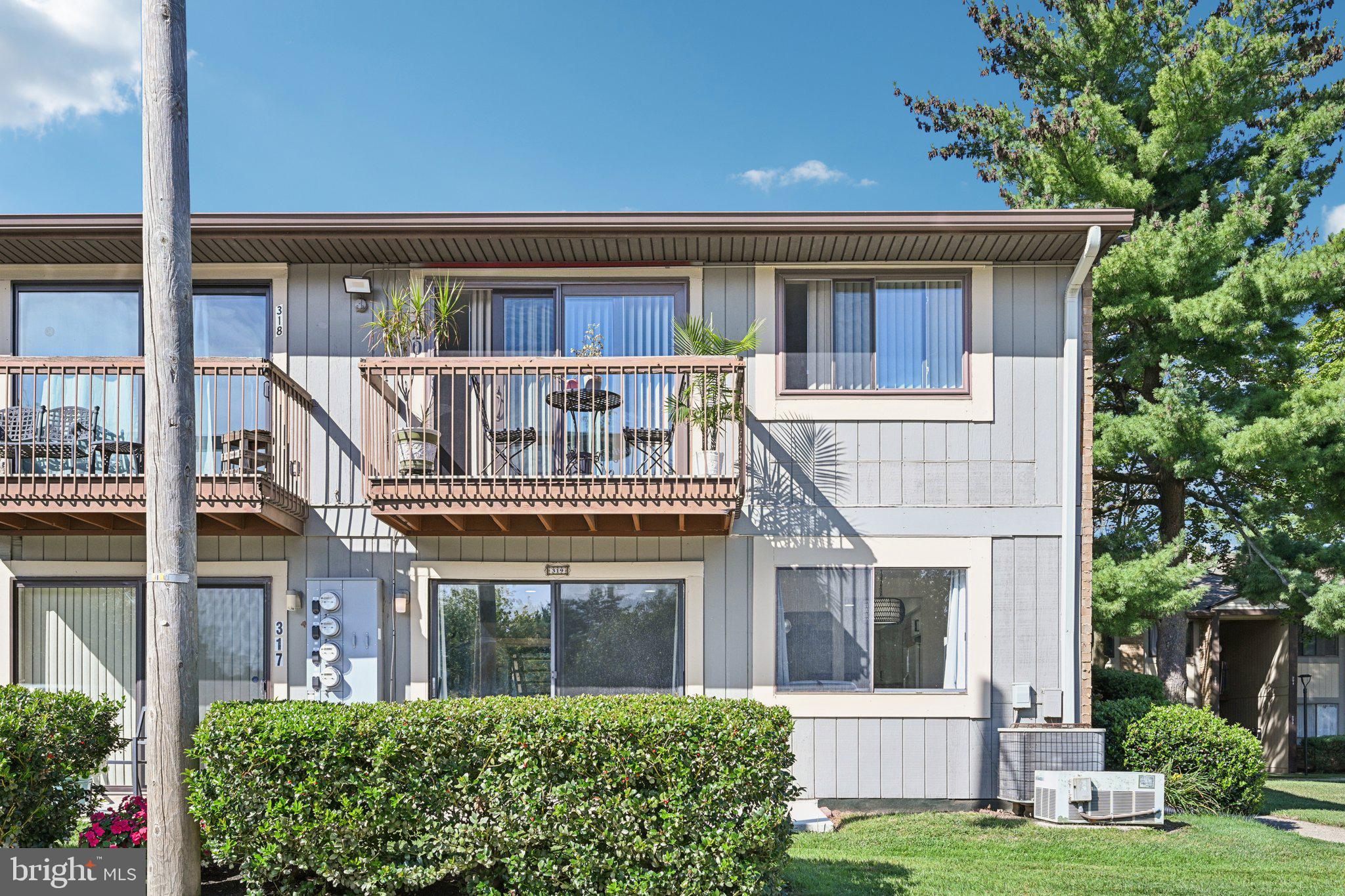 115 East Kings Highway, Unit 319 Maple Shade, NJ 08052 - Photo 24 of 37 front view of a house with a yard