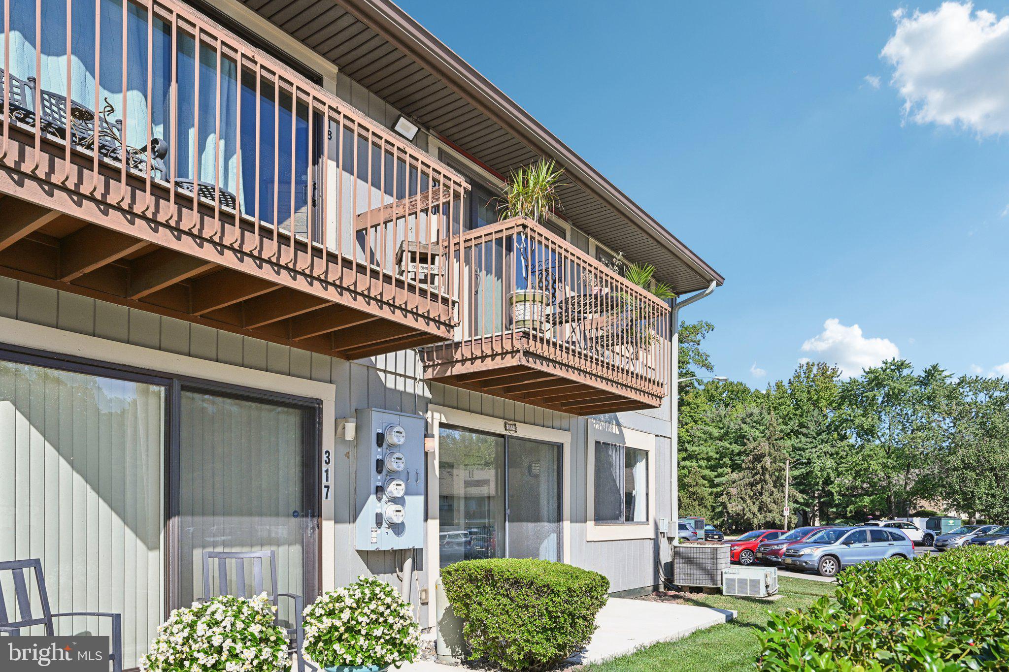 115 East Kings Highway, Unit 319 Maple Shade, NJ 08052 - Photo 25 of 37 a front view of a house with a yard