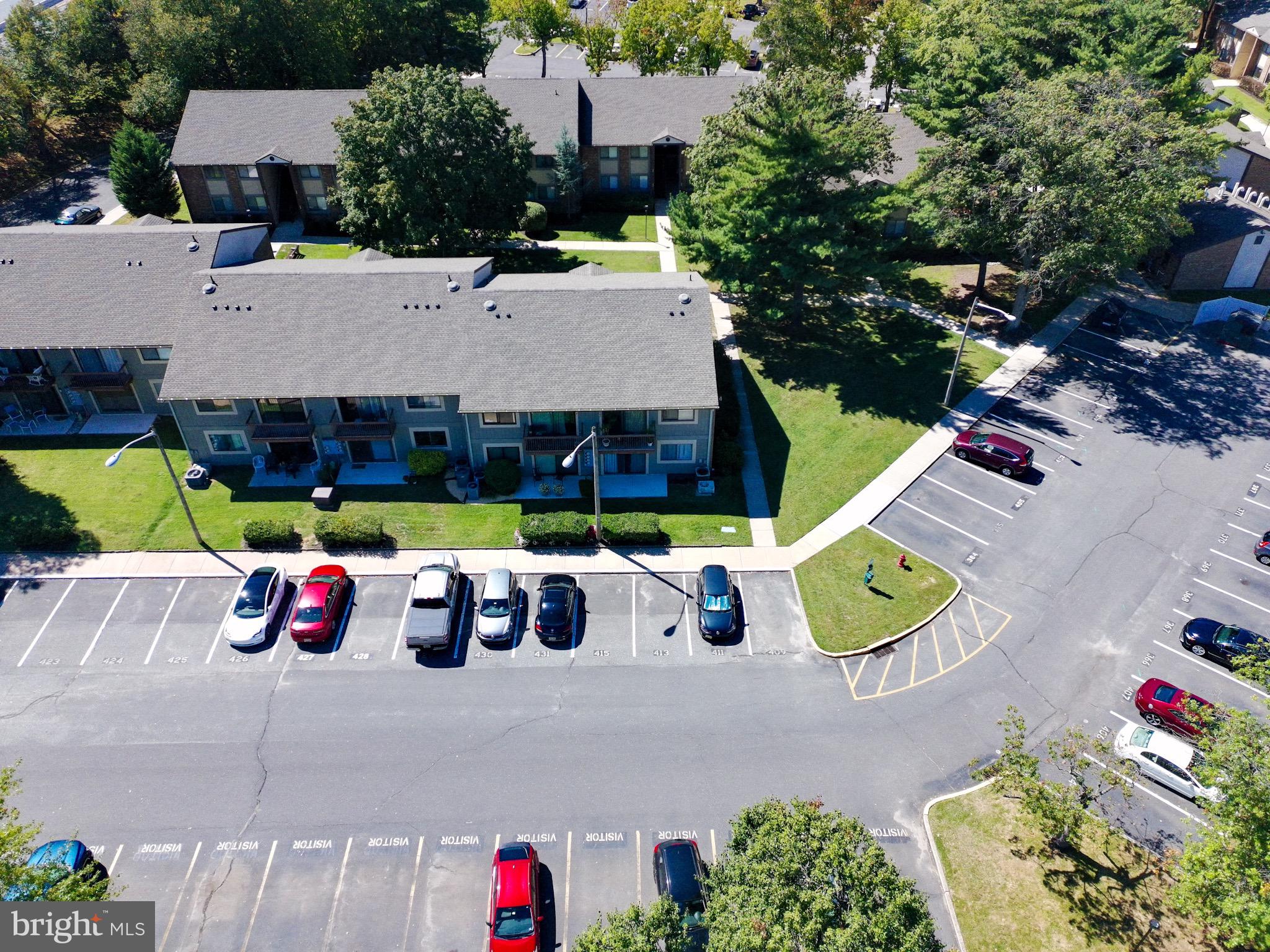 115 East Kings Highway, Unit 319 Maple Shade, NJ 08052 - Photo 30 of 37 an aerial view of a house with swimming pool and seating area