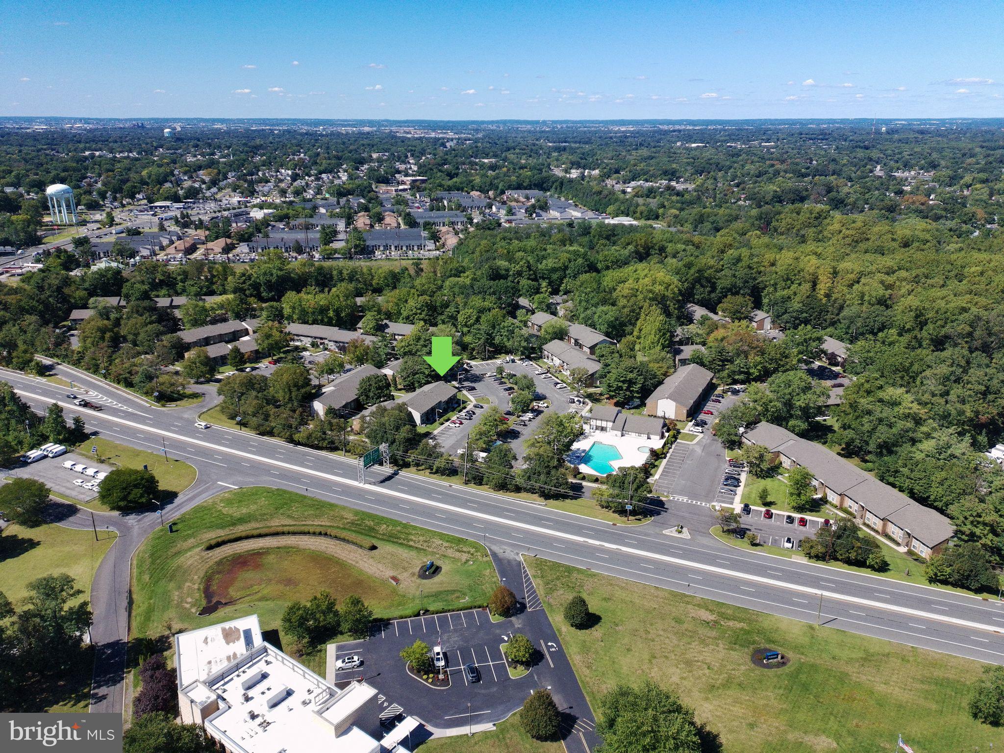 115 East Kings Highway, Unit 319 Maple Shade, NJ 08052 - Photo 35 of 37 an aerial view of a house a yard and swimming pool