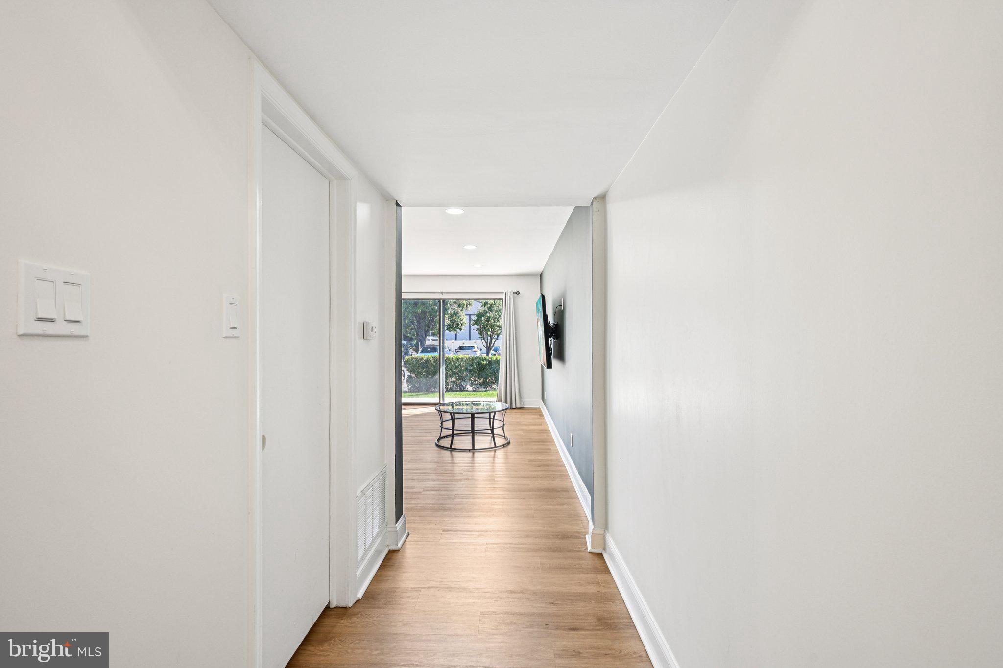 115 East Kings Highway, Unit 319 Maple Shade, NJ 08052 - Photo 4 of 37 a view of a hallway with wooden floor