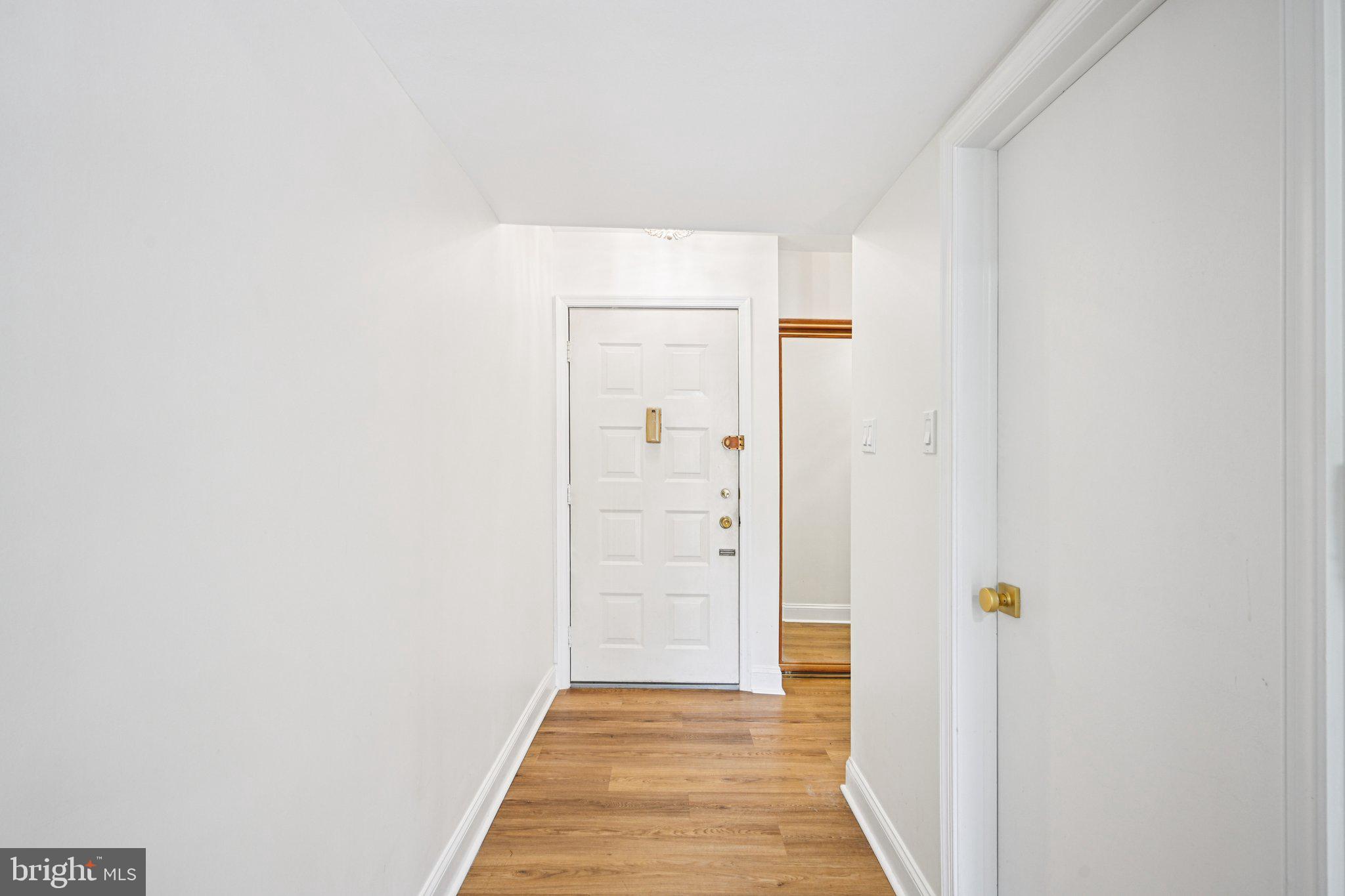 115 East Kings Highway, Unit 319 Maple Shade, NJ 08052 - Photo 5 of 37 a view of a hallway with wooden floor