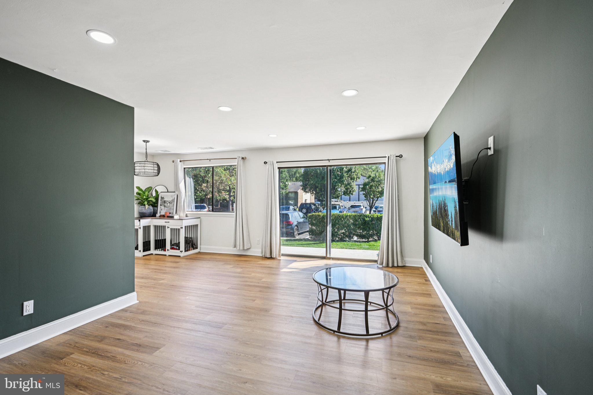 115 East Kings Highway, Unit 319 Maple Shade, NJ 08052 - Photo 6 of 37 a living room with furniture and a flat screen tv