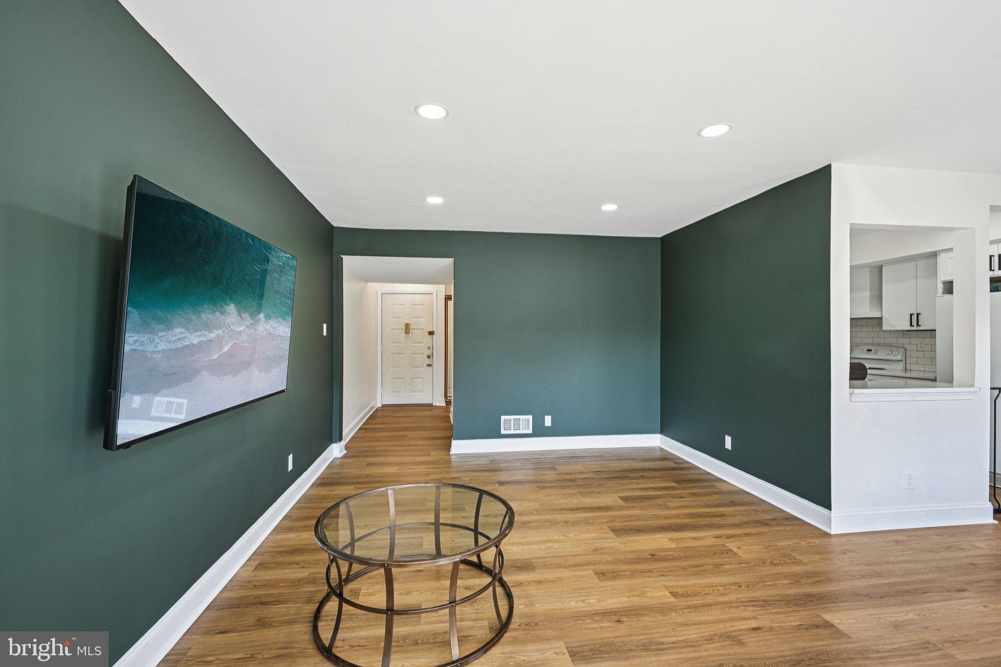 115 East Kings Highway, Unit 319 Maple Shade, NJ 08052 - Photo 7 of 37 a view of a livingroom with wooden floor