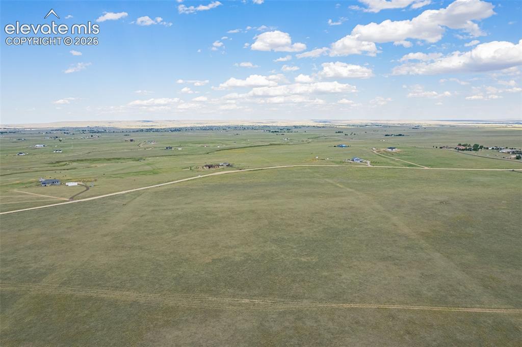 6870 Cowboy Rnch View Peyton, CO 80831 - Photo 9 of 16 a view of an ocean and beach