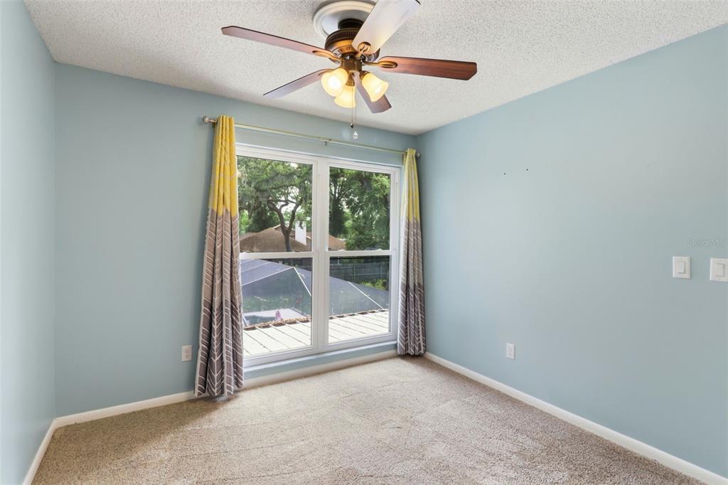 302 Bloomingfield Drive Brandon, FL 33511 - Photo 32 of 58 a view of a livingroom with a ceiling fan and window
