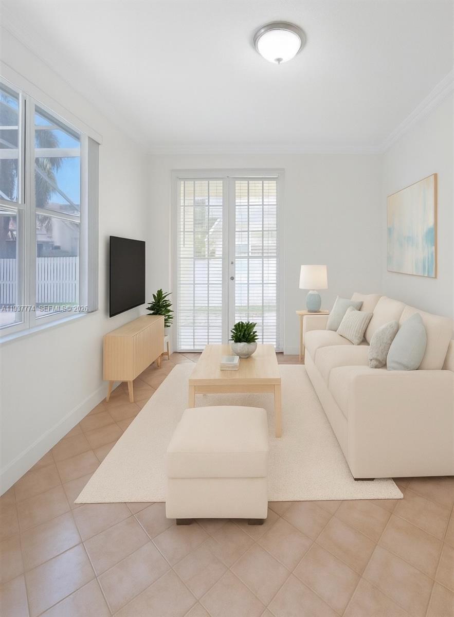 797 Chimney Rock Road, Unit 797 Weston, FL 33327 - Photo 11 of 26 a living room with furniture and a flat screen tv