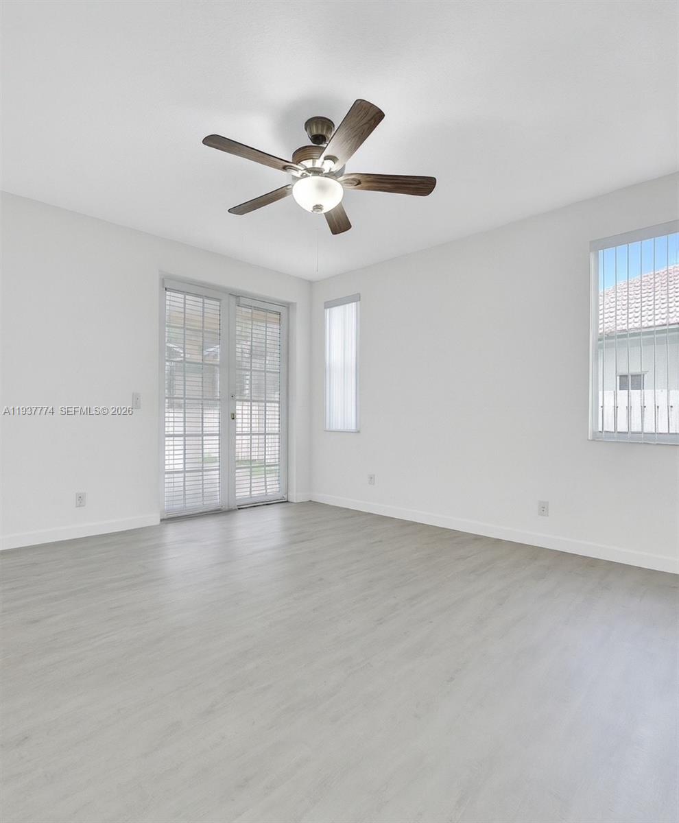 797 Chimney Rock Road, Unit 797 Weston, FL 33327 - Photo 16 of 26 a view of an empty room with a window