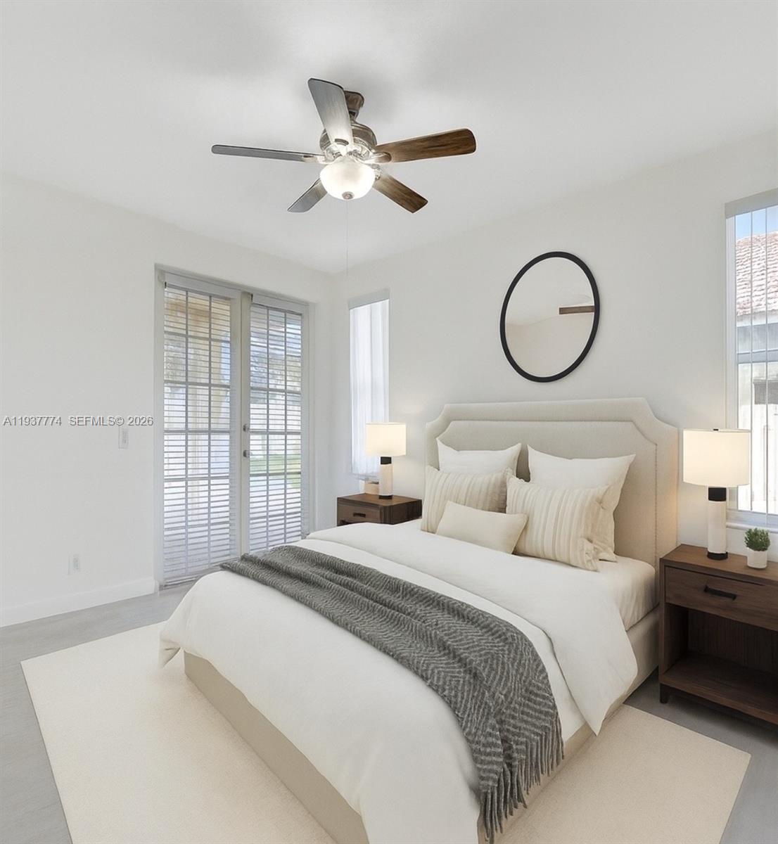 797 Chimney Rock Road, Unit 797 Weston, FL 33327 - Photo 17 of 26 a bedroom with a bed and a chandelier