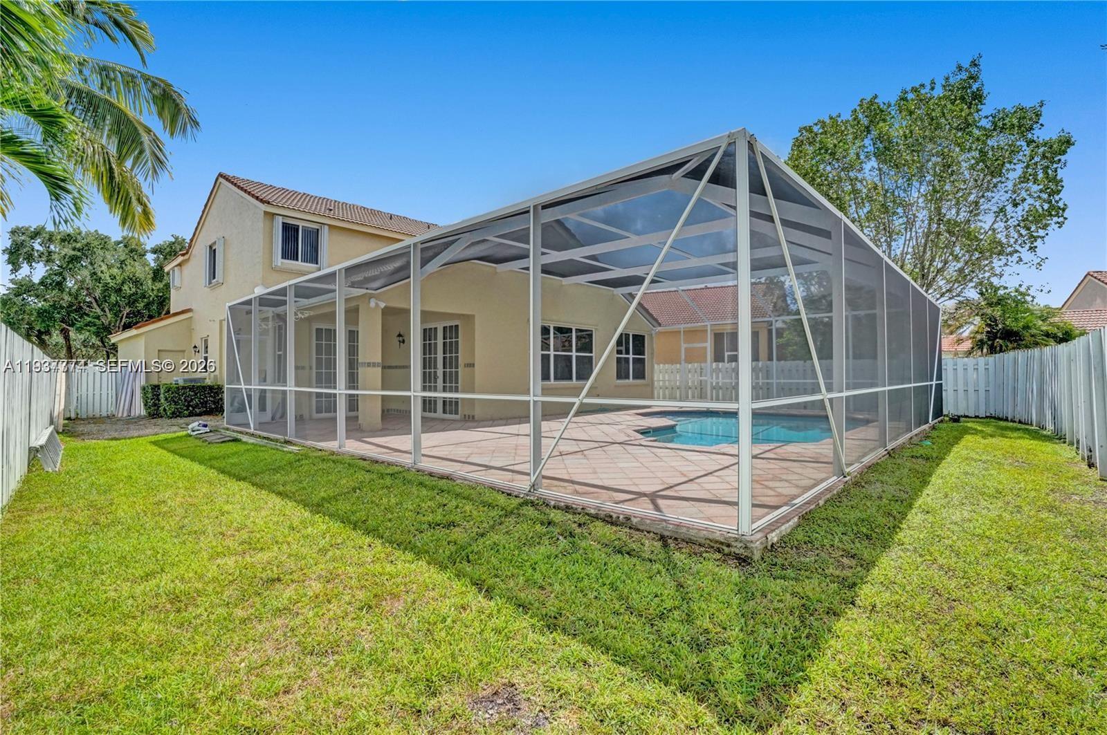 797 Chimney Rock Road, Unit 797 Weston, FL 33327 - Photo 3 of 26 a view of backyard with green space