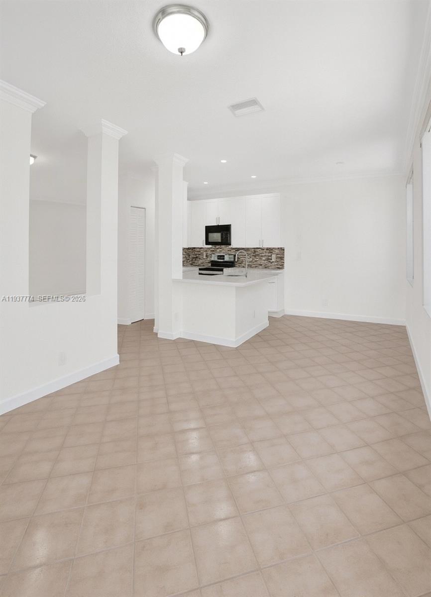 797 Chimney Rock Road, Unit 797 Weston, FL 33327 - Photo 9 of 26 a view of kitchen with stainless steel appliances cabinets