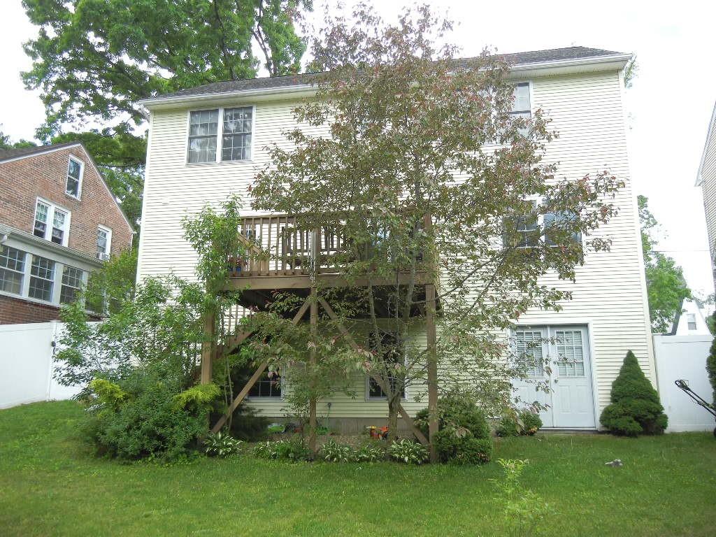 113 Appleton Street Springfield, MA 01108 - Photo 11 of 40 a view of a house with a garden