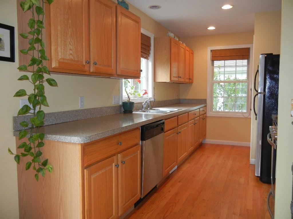 113 Appleton Street Springfield, MA 01108 - Photo 12 of 40 a kitchen with stainless steel appliances granite countertop a sink a refrigerator and a granite counter tops