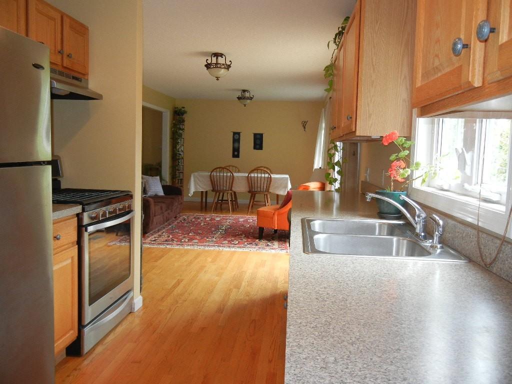 113 Appleton Street Springfield, MA 01108 - Photo 15 of 40 a kitchen with stainless steel appliances granite countertop a sink and a refrigerator