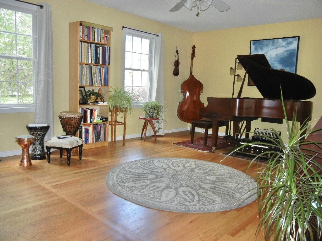 113 Appleton Street Springfield, MA 01108 - Photo 23 of 40 a living room with furniture and a window