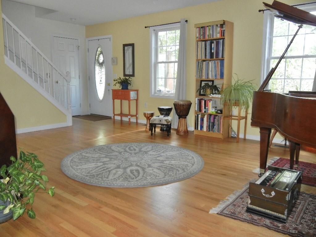 113 Appleton Street Springfield, MA 01108 - Photo 24 of 40 a living room with furniture and a wooden floor