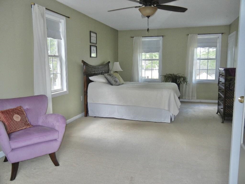 113 Appleton Street Springfield, MA 01108 - Photo 26 of 40 a bedroom with a bed couch and windows