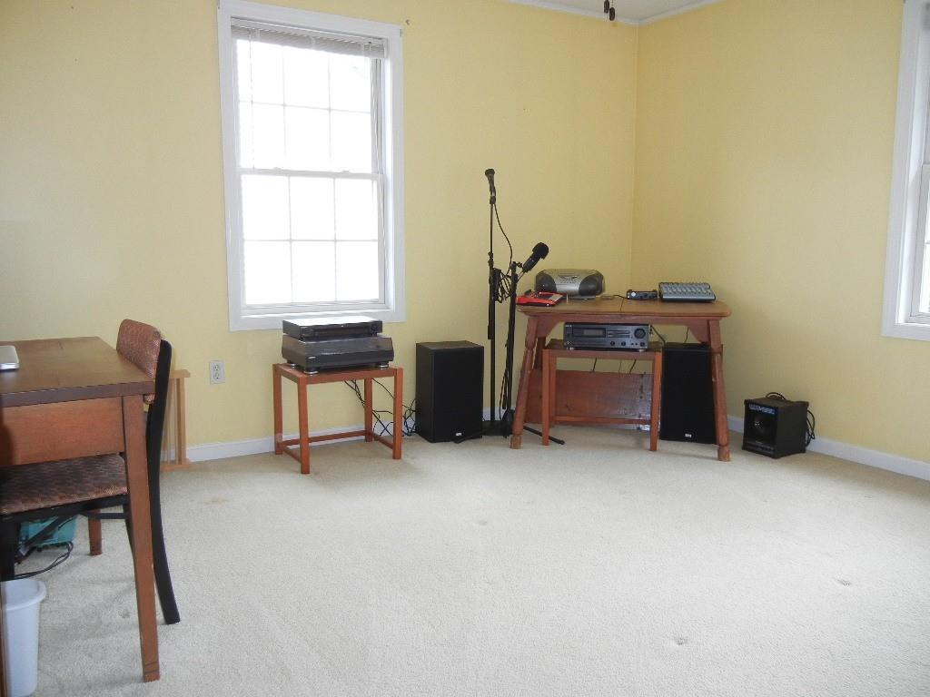 113 Appleton Street Springfield, MA 01108 - Photo 29 of 40 a view of a workspace with furniture and a window