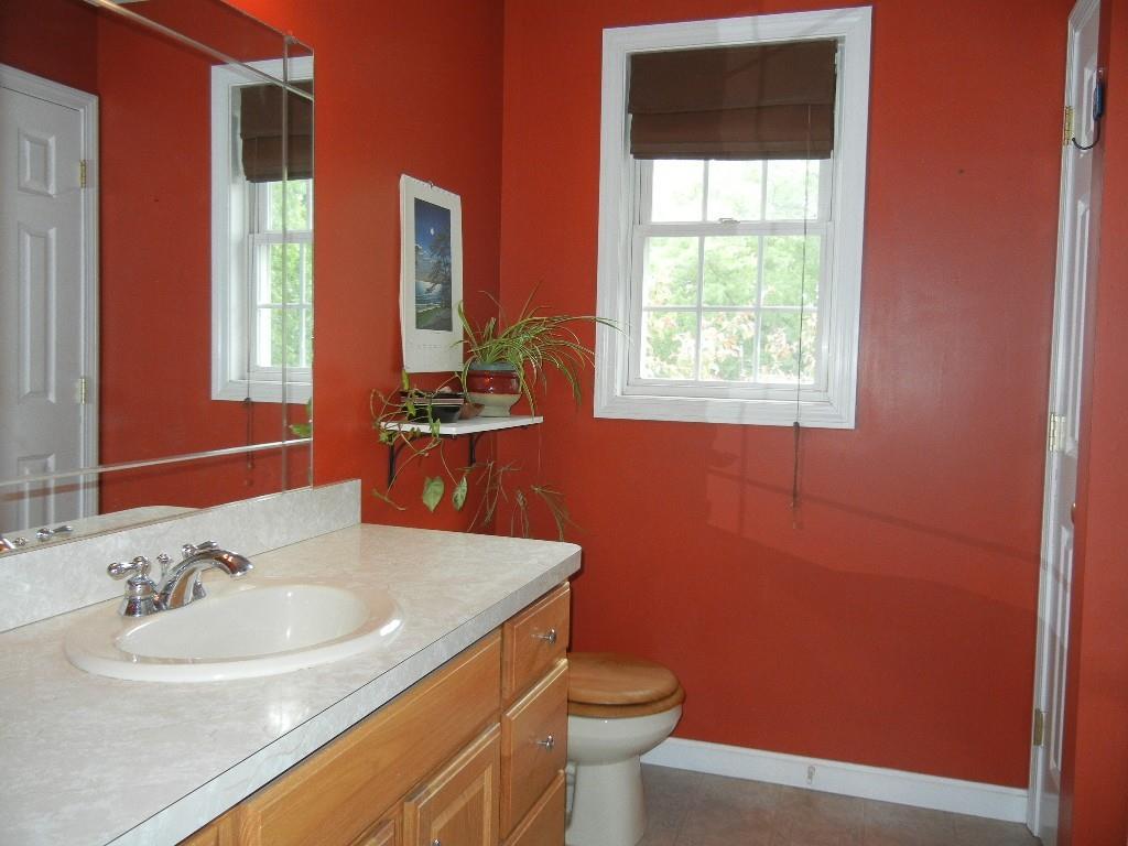 113 Appleton Street Springfield, MA 01108 - Photo 30 of 40 a bathroom with a sink a toilet and a window