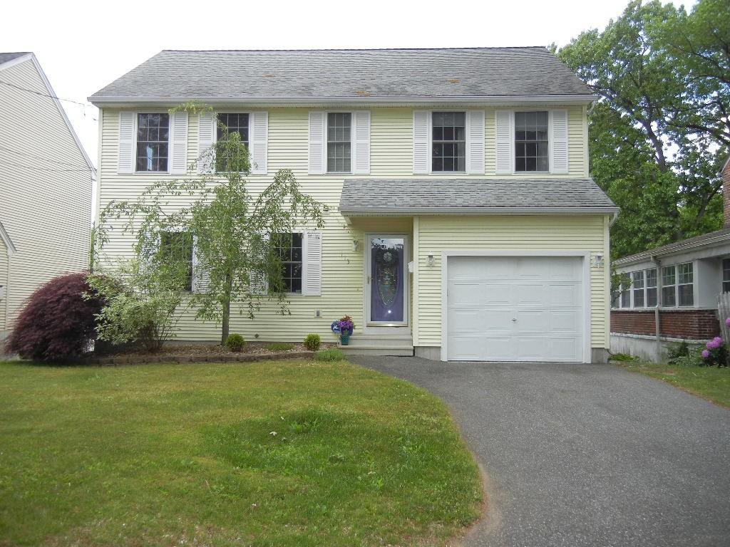 113 Appleton Street Springfield, MA 01108 - Photo 3 of 40 a front view of a house with a garden and yard