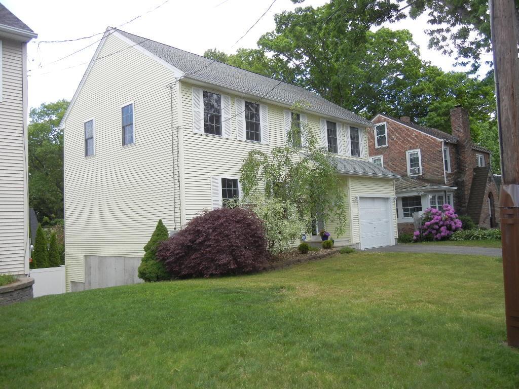 113 Appleton Street Springfield, MA 01108 - Photo 5 of 40 a front view of a house with a garden