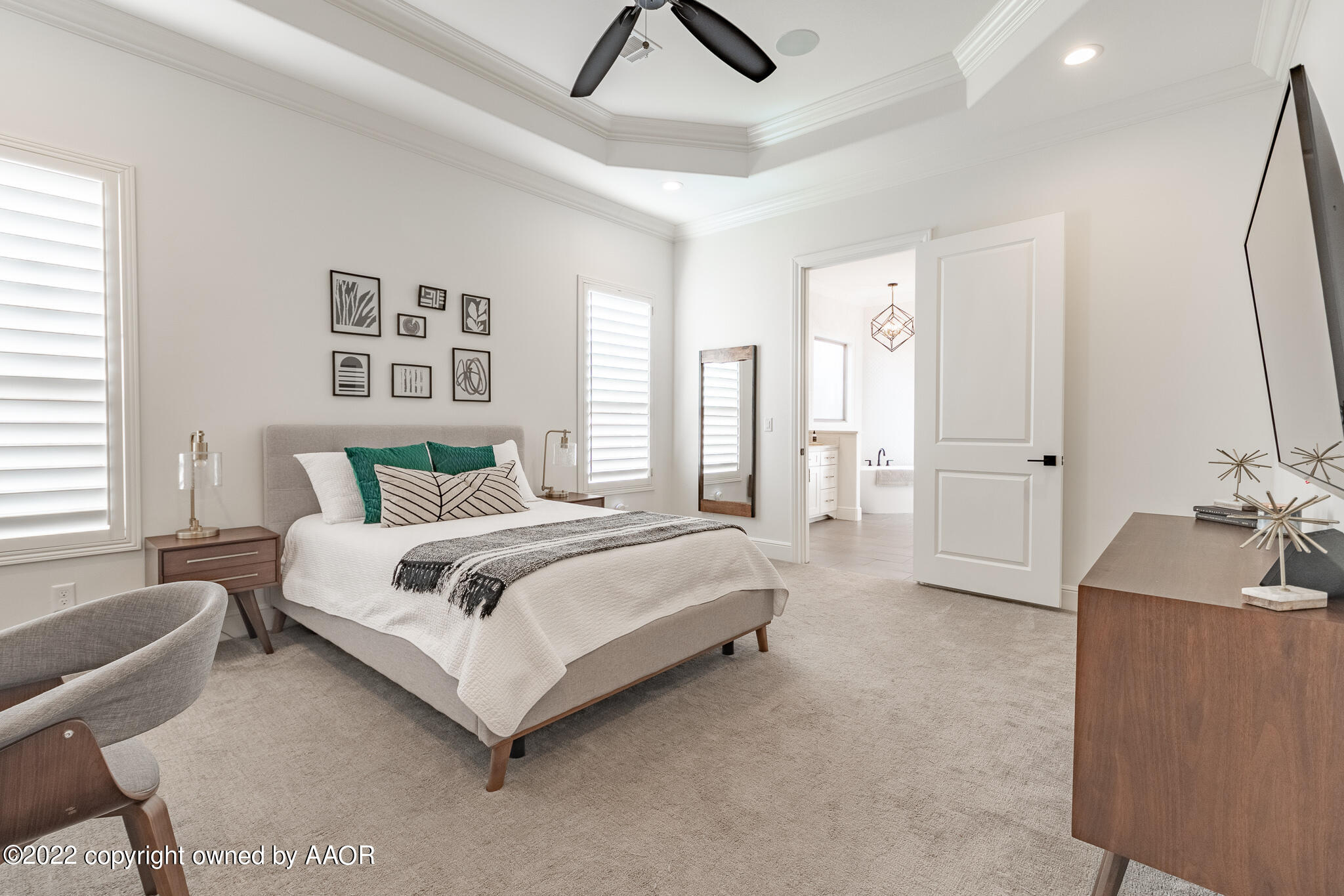 8406 Georgetown Drive Amarillo, TX 79119 - Photo 19 of 43 a spacious bedroom with a bed and a couch
