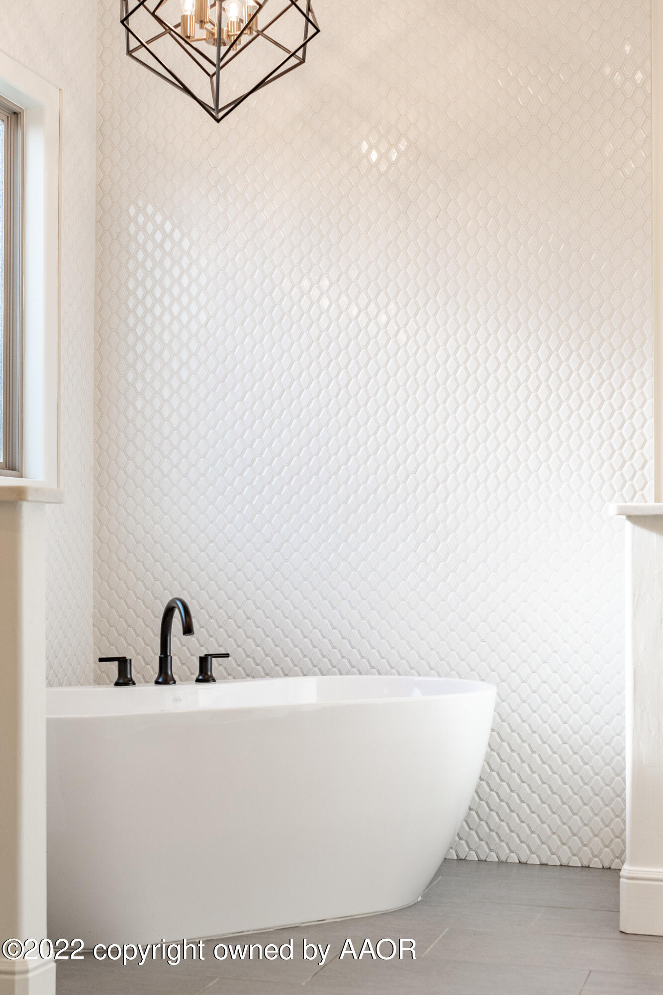 8406 Georgetown Drive Amarillo, TX 79119 - Photo 22 of 43 a white tub sitting next to a shower