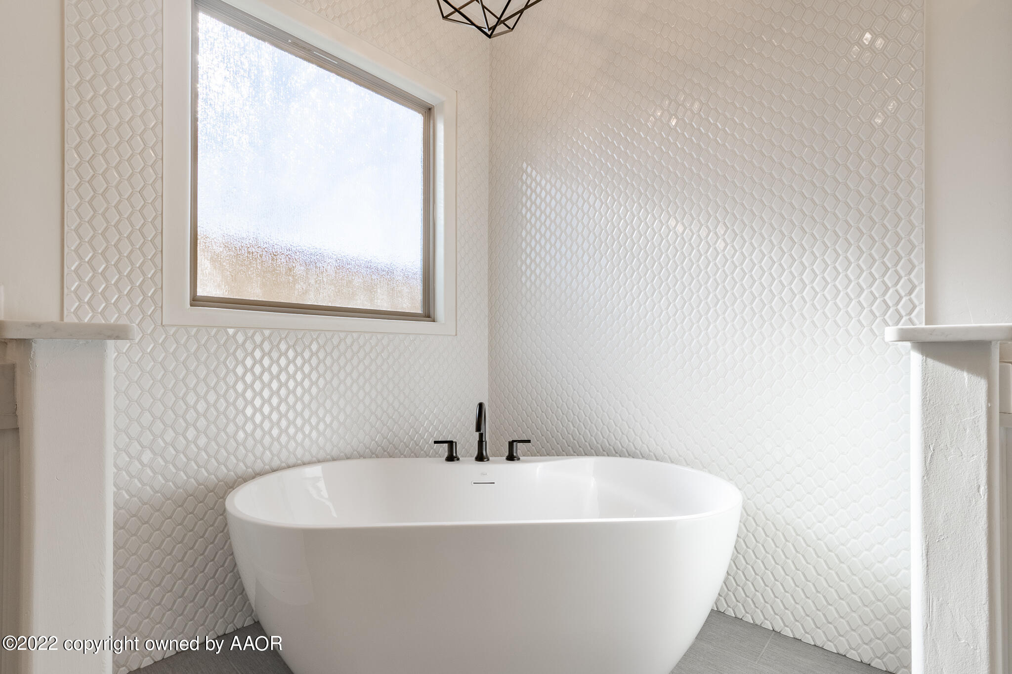 8406 Georgetown Drive Amarillo, TX 79119 - Photo 25 of 43 a white bath tub sitting next to a window
