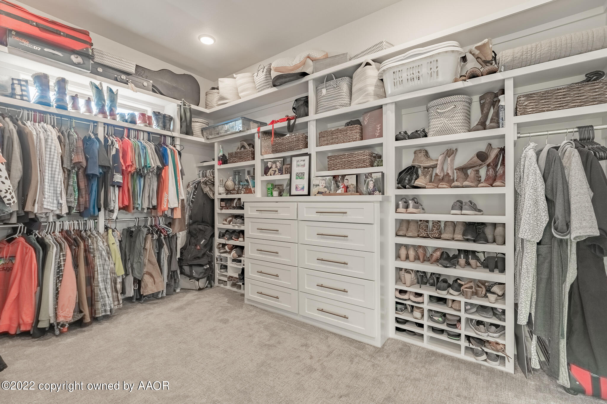 8406 Georgetown Drive Amarillo, TX 79119 - Photo 26 of 43 a view of walk in closet with clothes and shoes