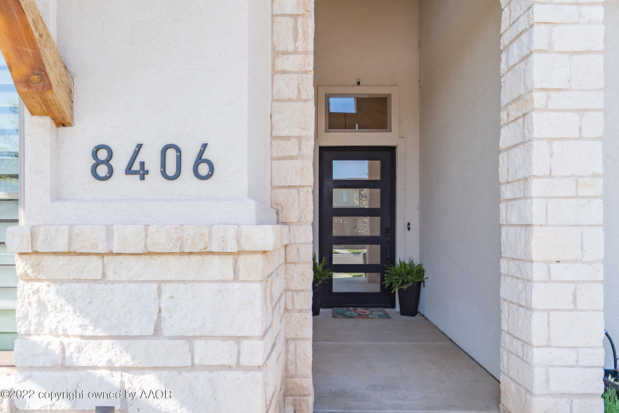 8406 Georgetown Drive Amarillo, TX 79119 - Photo 4 of 43 a view of door with wooden wall