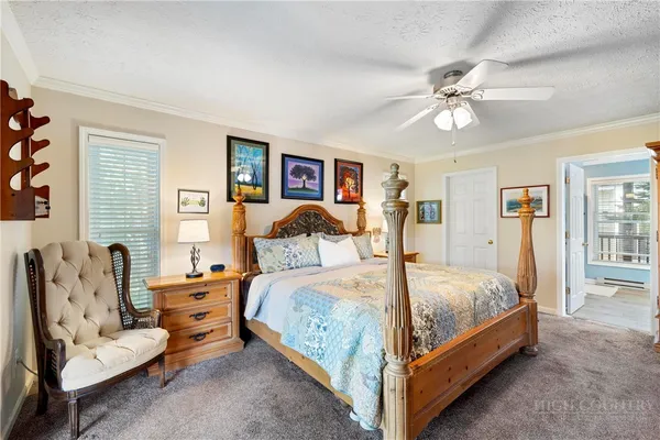 a bedroom with bed and window