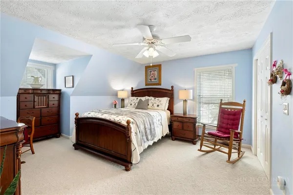 a bedroom with a bed and furniture