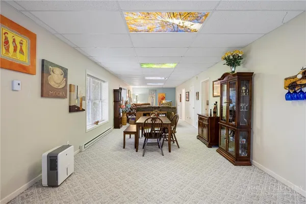 a dining room with furniture and window