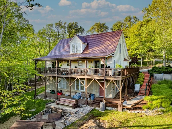 a view of a chairs and table in a patio