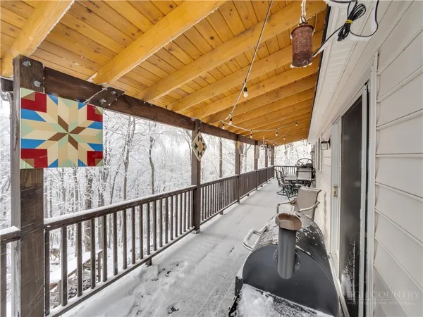 a view of outdoor space with seating area and trees