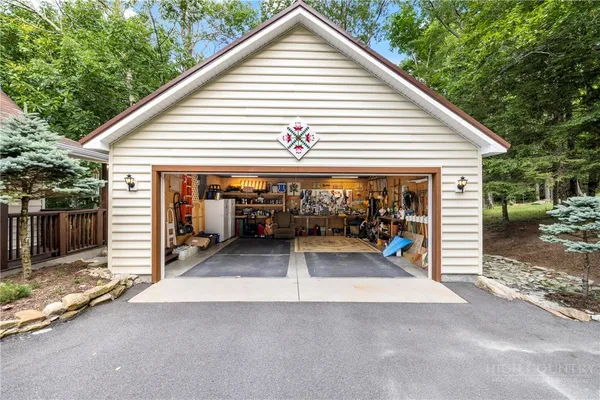 a view of a house with a patio and backyard