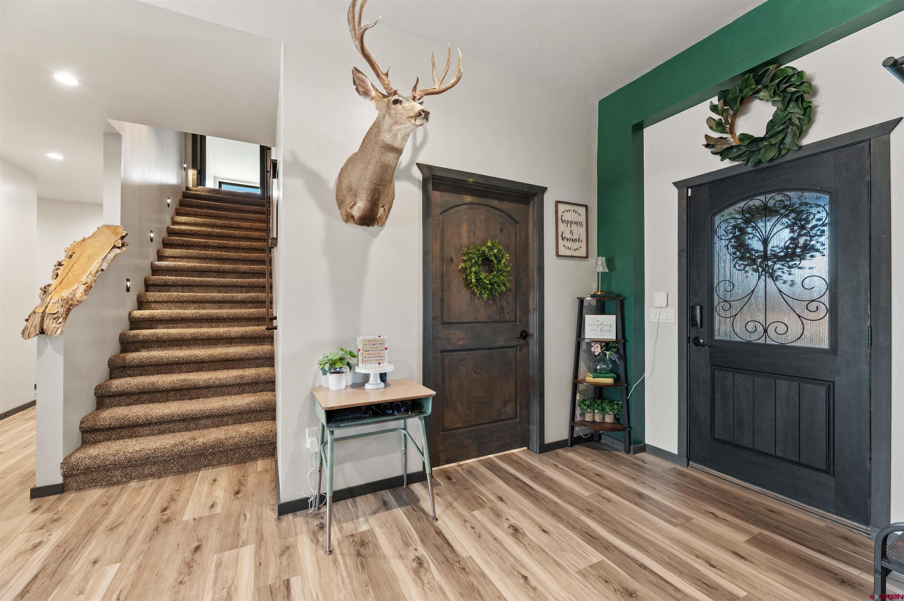 55347 Begonia Road Delta, CO 81416 - Photo 19 of 44 a view of a bedroom with wooden floor and stairs