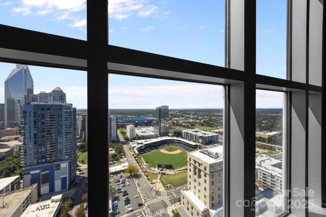 a kitchen with stainless steel appliances granite countertop a refrigerator sink and stove