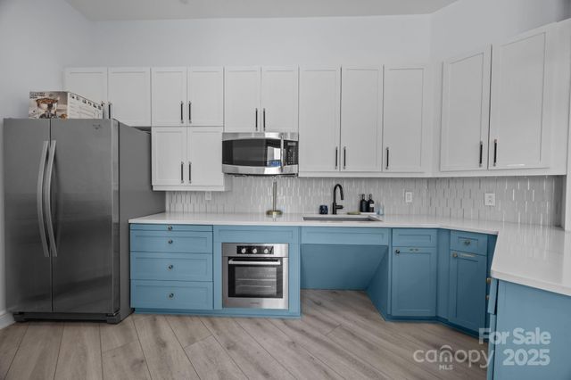 a view of a fireplace with wooden fence