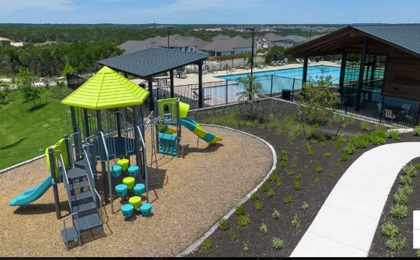 an aerial view of a house with a garden